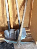 Two spade shovels and a pick axe with a 2' head.