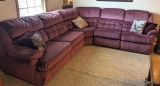 Sectional sofa with one reclining end would be great in a family room. Piece is comfortable and in