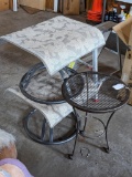 Two patio stool or foot rests, plus an expanded metal patio table measures 16