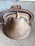 Cast iron school bell with harp dated 1886 on one side and Crystal Metal on the other. Bell is