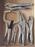 Three pairs of Vice Grips and two other pairs of locking pliers.