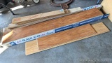 Box and a half of Quick Step laminate flooring with some transition strips and more.