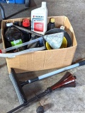 Several bottles of ATV oil, yard torch and fuel, and more.