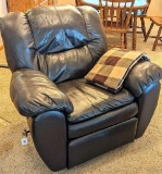 Very comfortable overstuffed faux leather rocker recliner is in very good condition with only two