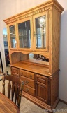 Beautiful lighted hutch stands 6-1/2' tall with adjustable glass shelf, flatware storage drawer and