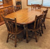 Nice dining set with six chairs is in very good condition. Measures nearly 5-1/2' with two 12