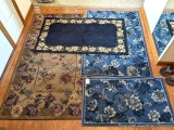 Four entry or small area rugs. Largest is 40