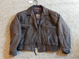 Brown leather jacket by Wilsons is men's size XL and in good condition.