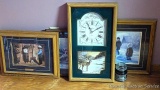 Three framed prints and a wall clock, plus a Yankee candle. Clock measures 14