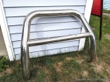Chromed steel bumper or brush guard measures just over 3 feet wide and 37