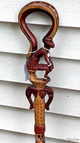 Eye-catching African tribal style walking stick or decor measures 36" tall.