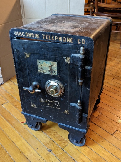 Delightfully small antique Wehrle fire safe was once owned by the Wisconsin Telephone Company. Safe