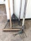 Dirt rake, weeding forks, push broom.