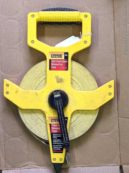 Empire 200 foot fiber glass measuring tape is in good condition.