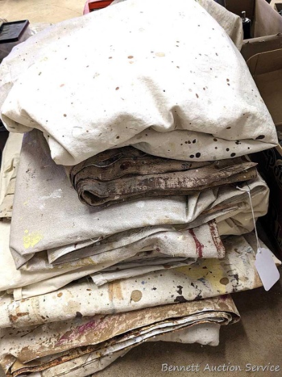 Pile of canvas painter drop cloths is about 2' x 2' x 1-1/2' high.