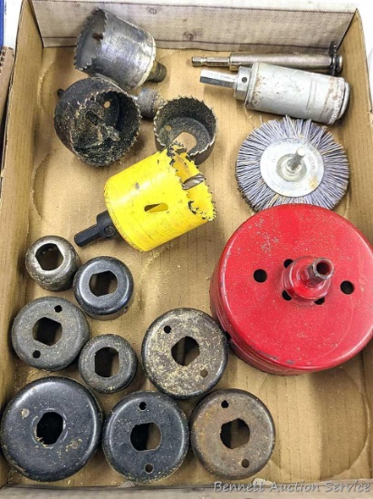 Hole saws up to 4" diameter, plus an abrasive bristle brush and a slitting saw. One hole saw is