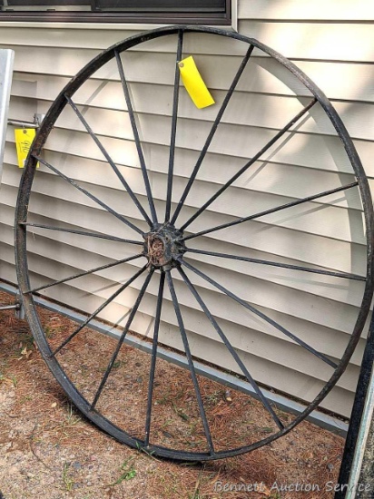 Steel decorative wagon wheel measures 53" across. Some character rust.