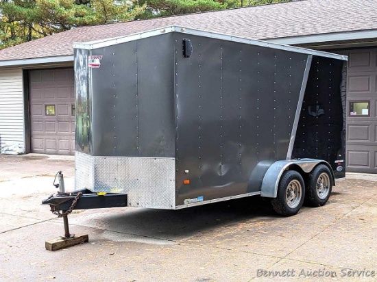 American Hauler Night Hawk tandem axle enclosed trailer is 14', plus V-nose. 7,000 lb gross weight.
