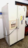 Whirlpool side by side refrigerator runs quietly and cools. Measures 35