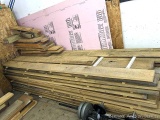 Pile of dry rough sawn hardwood boards and planks including oak, maple or birch, possibly others.