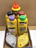 Two Stanley chalk lines and five colors of chalk. Chalk bottles are less than half full.