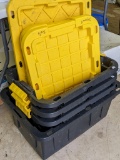 One 17 gallon and three 12 gallon heavy duty stackable totes with lids.