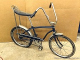 Classic bicycle from the 1960's or 70's complete with high rise banana seat, ape hanger handle bars,