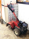 Toro rear tine rototiller with 5 hp Briggs & Stratton engine. Stored inside, so we didn't run it but