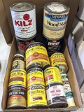 Minwax and other wood finishes and putty, some mostly full, and some mostly empty.