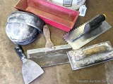Drywall tools and supplies including trowels, pan, knee pads, putty knife, knee pads.