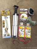 Utility organizers; window and door insulation shims, safety goggles, robotic arm, work tripod