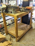 Four foot long wooden workbench has a spectacular working height at 39