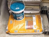 One gallon bucket of Dap Weldwood multi-purpose ceramic tile adhesive; unopened bag Schluter Systems