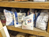 Partial bags of mortar, sheetrock joint compound, leveler, possibly other. Great for projects where