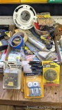 Two boxes of all the hardware you need incl. plumbing, door slides, latches, hooks, hinges, more.