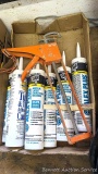 Six tubes of Alex Plus white caulk, and one other tube. Also comes with a nice caulk gun.