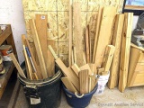 Three buckets of hardwood and other pieces of wood, the longest piece measures a little over 4 feet.