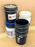 5-1/2' tall stack of buckets, some lids.