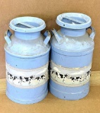Two milk cans are each 2' tall and in good condition.