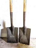 Two roof stripping shovels with nail notches.