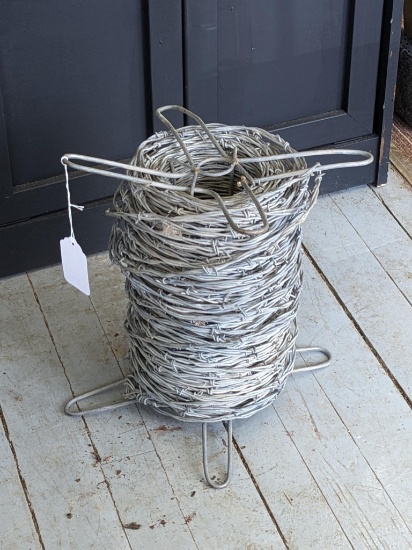 Pickup in Rib Lake. Spool of barbed wire; diameter measurement is 8".