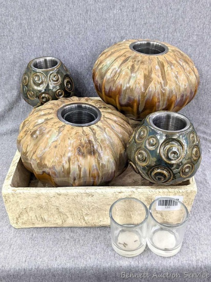 Four well-coordinated votive candle holders with removable inserts and 12" square plaster-like box