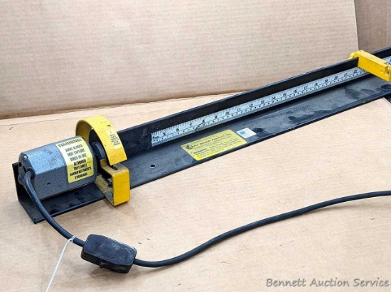 Arrow cutter by Apple Archery Products is about 40" long. Features postitionable arrow rest and