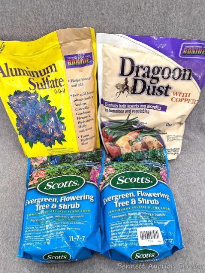 Two 3 lb bags of Scotts Evergreen, Flowering Tree and Shrub food, plus a 4 lb bag of Aluminum
