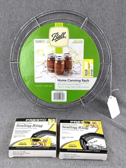 12" Ball home canning rack, two Presto pressure cooker seal rings with air vents.