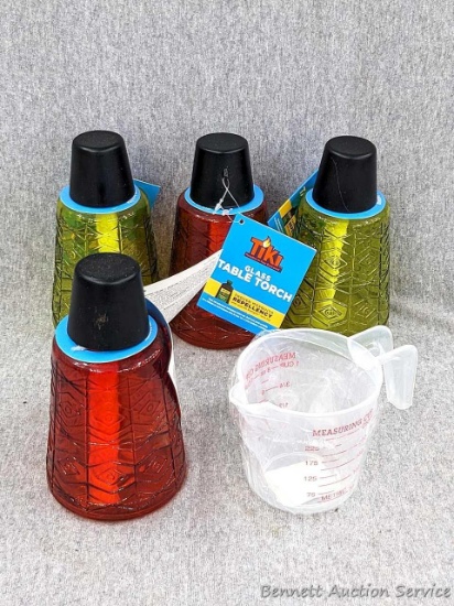 Eye pleasing glass Tiki torches for your patio table and deck stand about 6-1/4" tall. Incl cup to