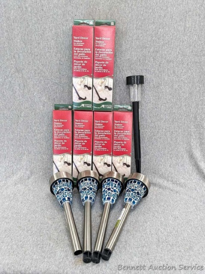 Four pretty 11" Outdoor Expressions yard lights, plus six boxes of yard stakes for wire frame