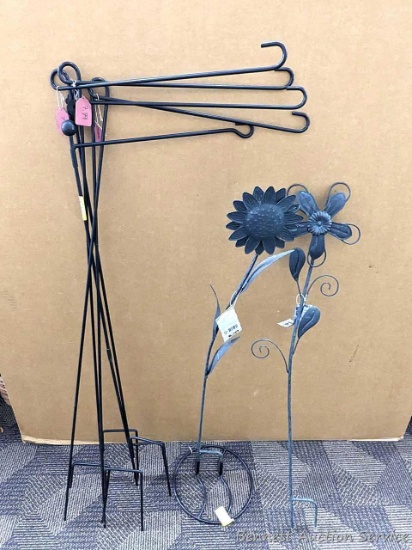 Variety of garden flag holders, garden decorations and flag stand holder. Tallest measures 44" tall