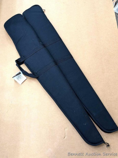Pair of black Bulldog Economy gun or rifle cases. Tag says "It Floats!" Measure 52" long.