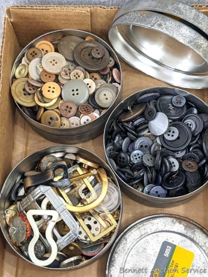 Three tins of buttons and belt buckles, as pictured. Tins are 4" diameter.